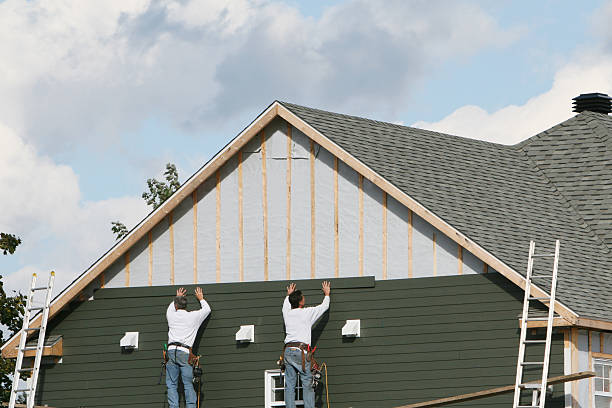 Professional Emergency Siding Repair technician working in Dover, OH